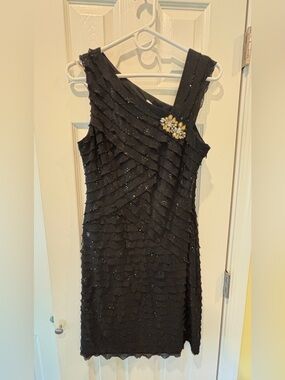 Amanda Lane Black One-Shoulder Sequin Ruffle Dress with Brooch